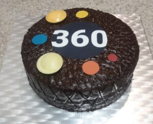 Cake decorated with 360Giving's logo